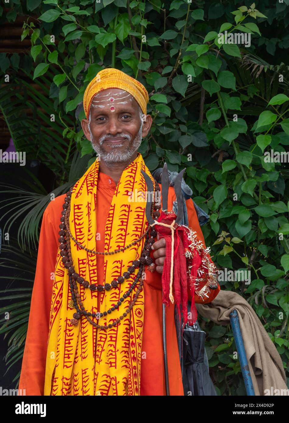 Asia, Nepal, Pokhara. Colorful religious Nepali man (Editorial Use Only) Stock Photo