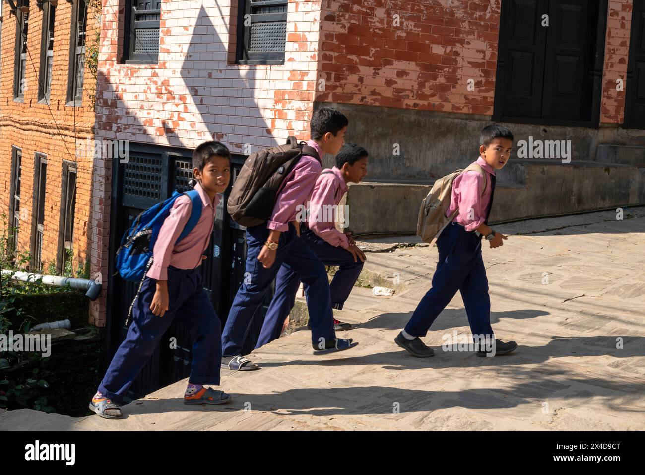 Asia, Nepal, Bandipur. Young boys walking to school (Editorial Use Only) Stock Photo