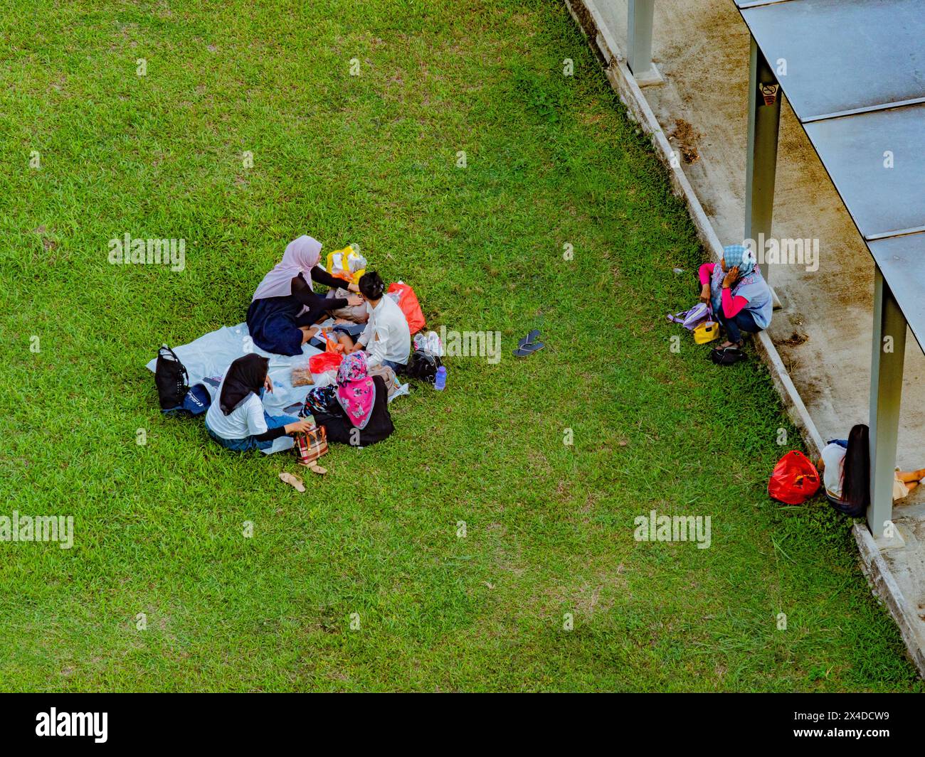 female migrant workers weekend picnic in singapore Stock Photo