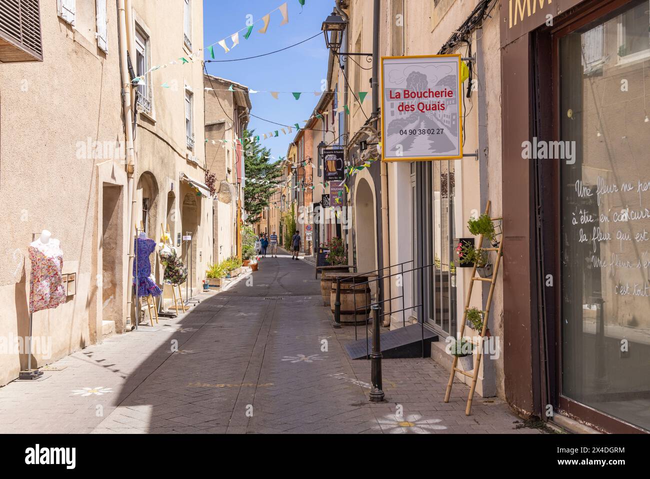 L'Isle-sur-la-Sorgue, Avignon, Vaucluse, Provence-Alpes-Cote d'Azur, France. Shops on an alley. (Editorial Use Only) Stock Photo