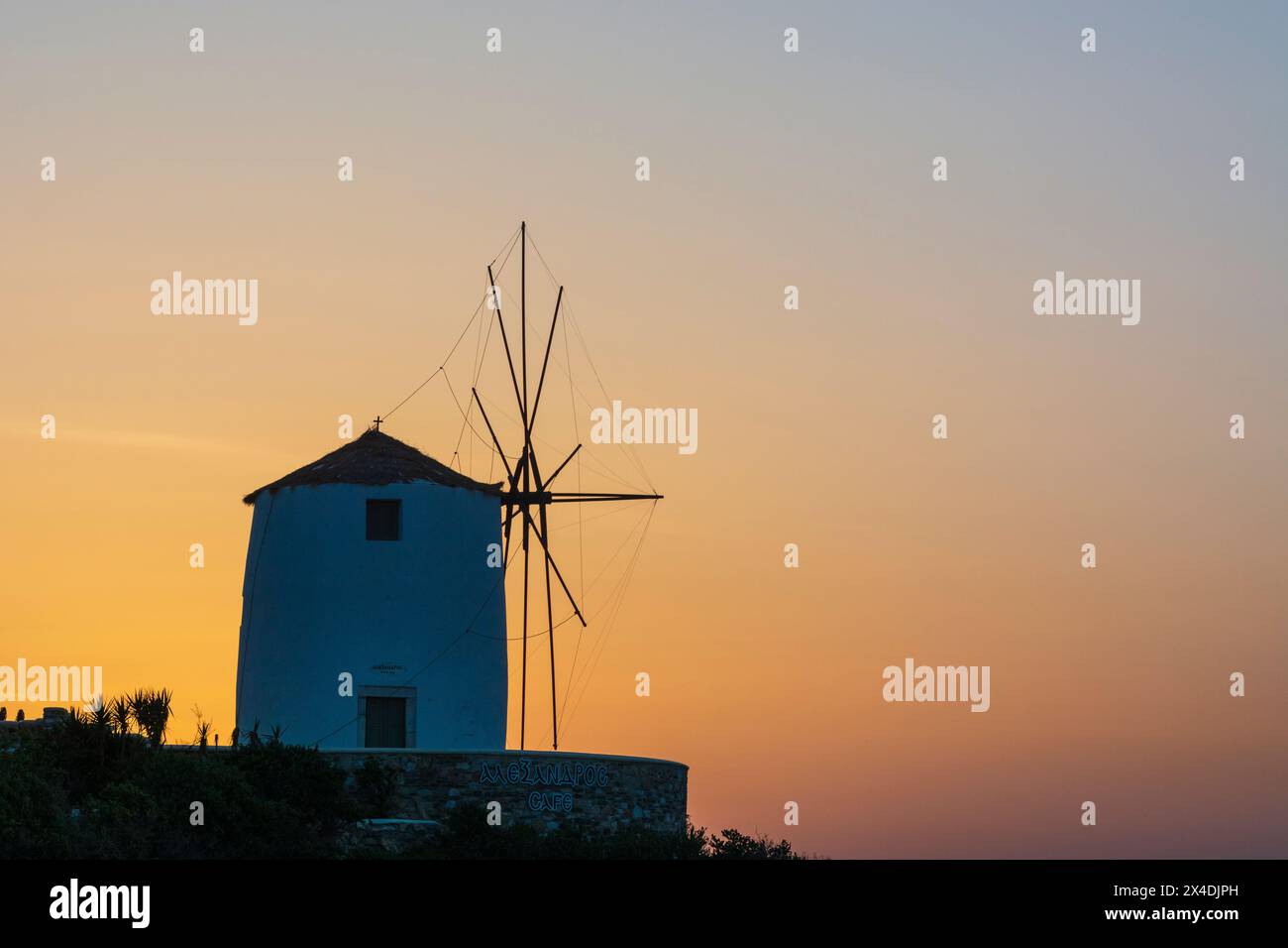 A windmill at sunset in Parikia, Paros Island, Cyclades Islands, Greece. Stock Photo