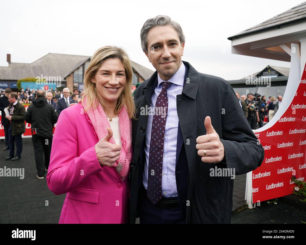 Former jockey and Fine Gael candidate for the Midlands–North-West constituency at the 2024 European Parliament elections Nina Carberry with Taoiseach Simon Harris on day three of the Punchestown Festival at Punchestown Racecourse, County Kildare. Picture date: Thursday May 2, 2024. Stock Photo