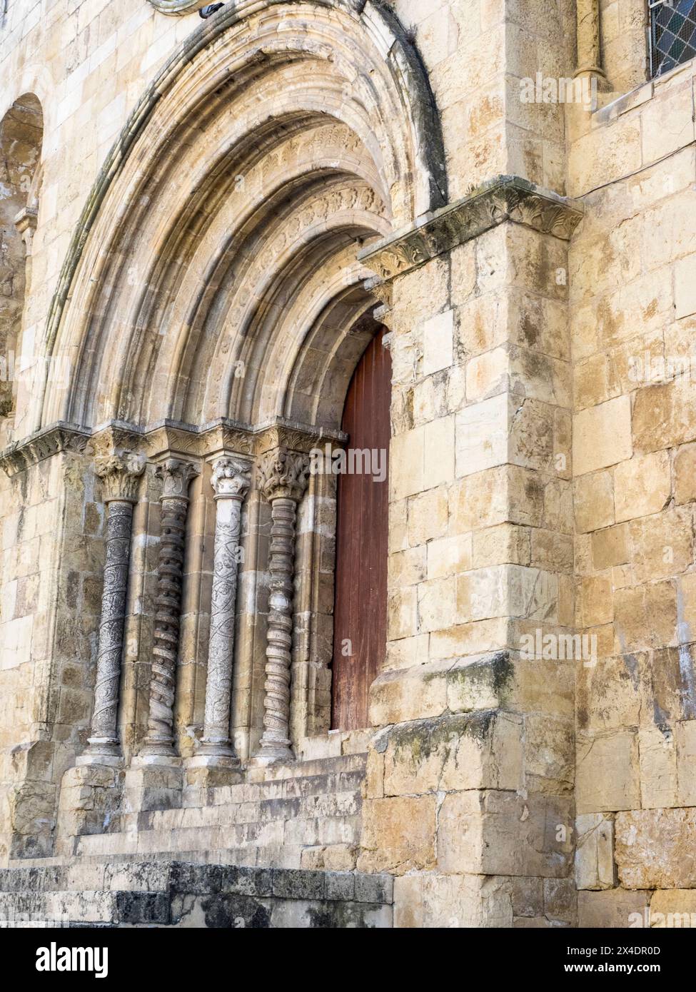 Entrance facade of Se Velha, Santa Maria de Coimbra, the old Cathedral of Coimbra. Stock Photo