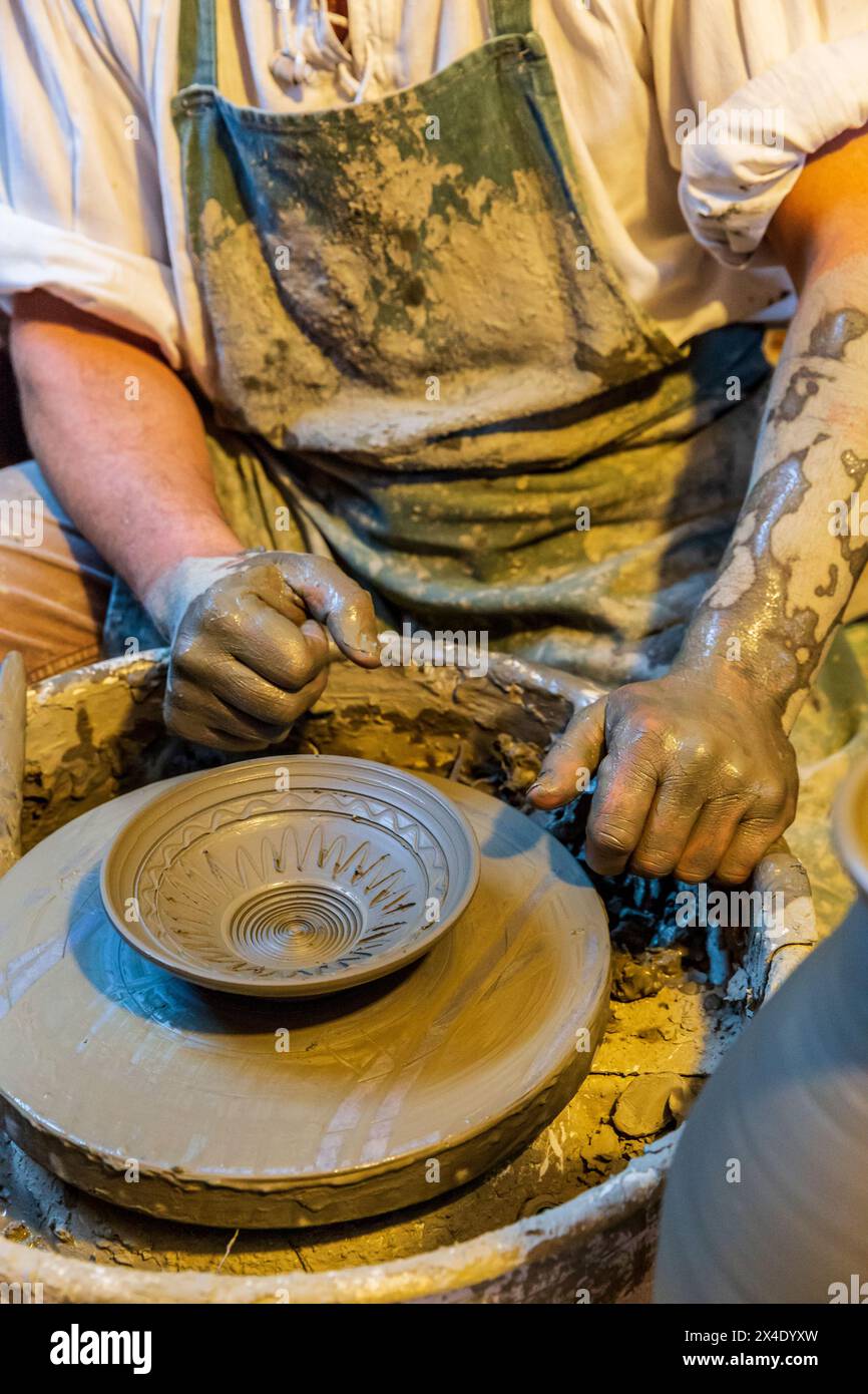 Romania, Transylvania, Maramures, Baie Mare. Casa Ola Rului. Traditional Romanian clay pottery exhibit. Potter and his wheel. (Editorial Use Only) Stock Photo