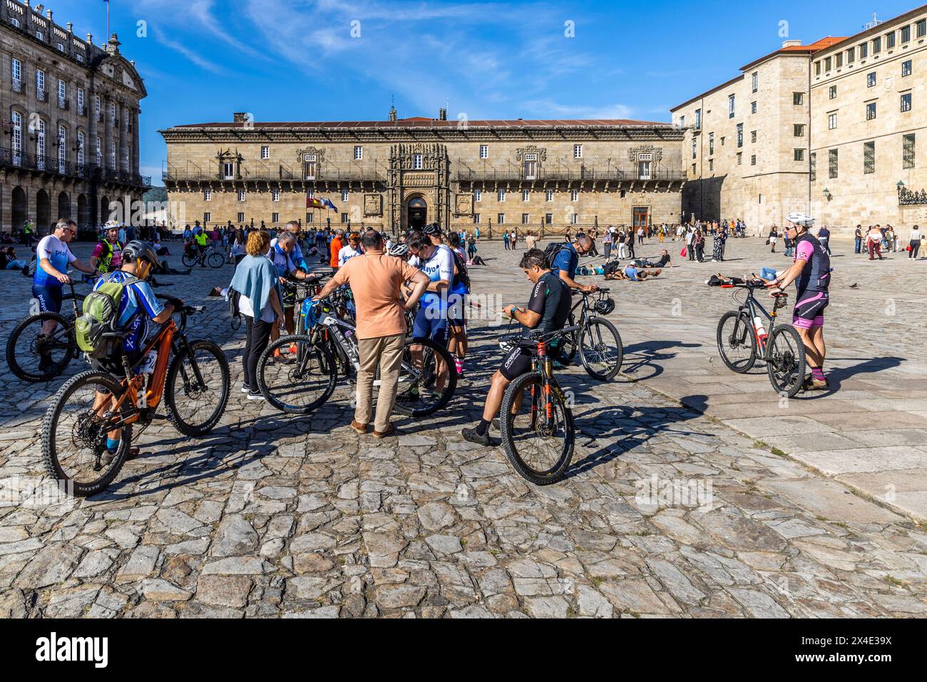Spain, Galicia. Santiago de Compostela, pilgrims celebrating and relaxing in the square at the cathedral upon the completion of their Camino. (Editori Stock Photo