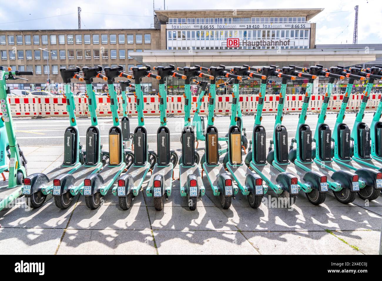 Parking space for e-scooters at the main station, provider Tier, in e-scooter sharing with Ruhrbahn, Essen, NRW, Germany, Stock Photo