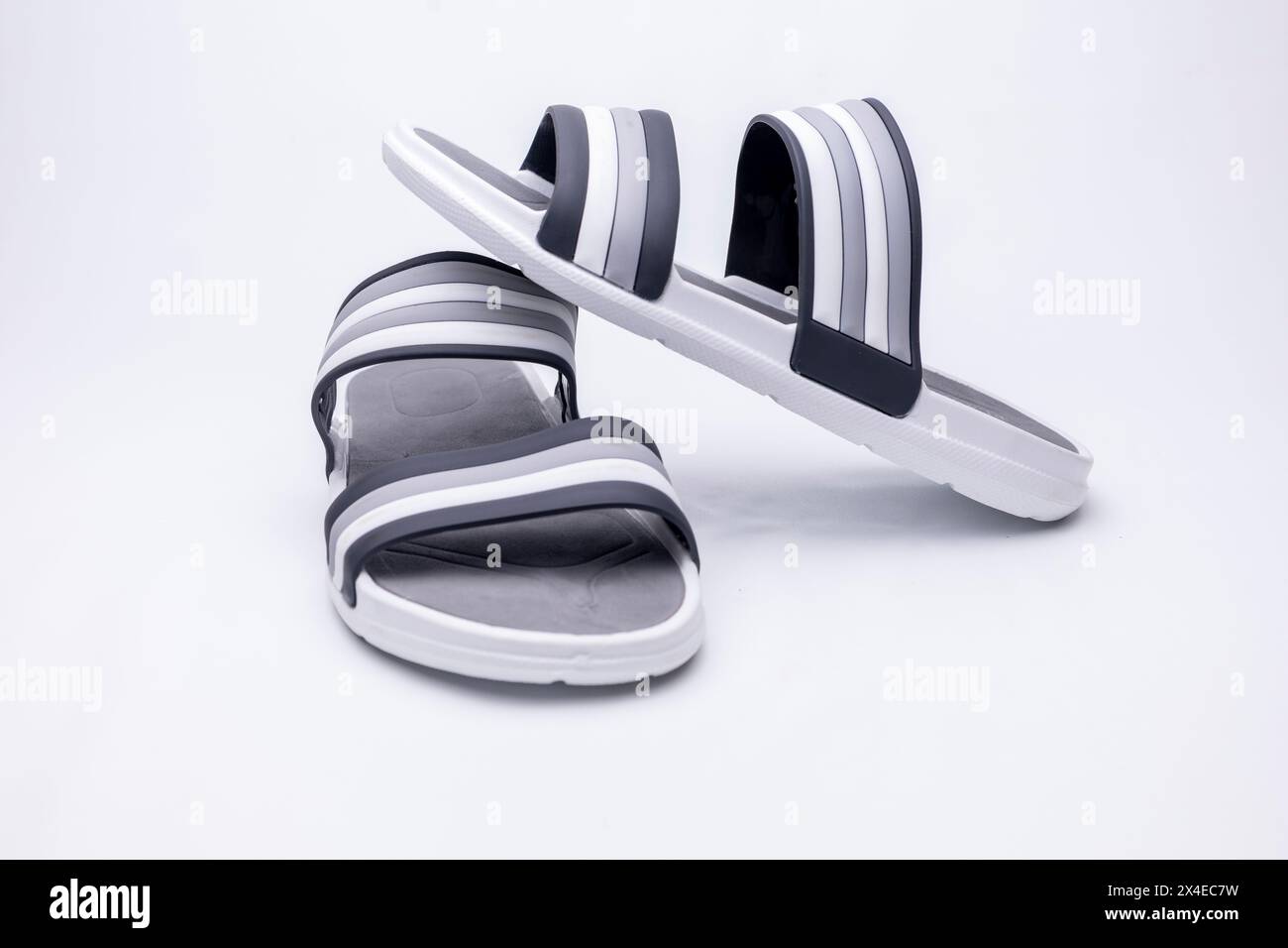 White and blue summer men's flip flops on white Stock Photo - Alamy