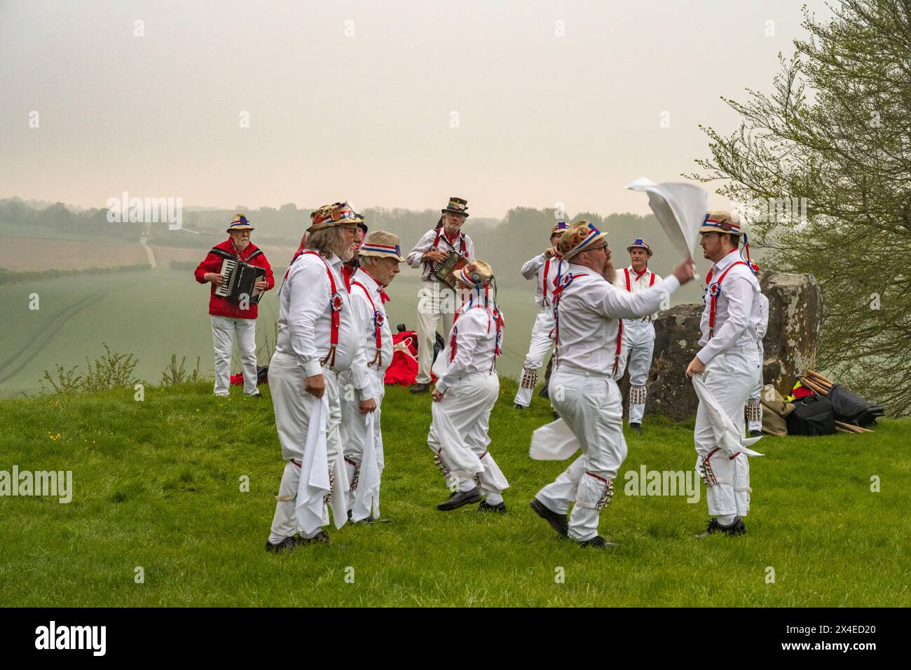 Morris Dancers awelcoming the dawn on May Day, at Coldrum Long Barrow Kent Stock Photo