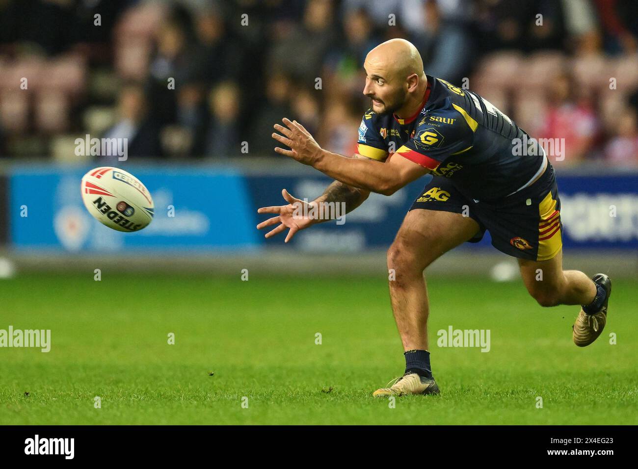 Alrix Da Costa of Catalan Dragons passes the ball during the Betfred Super League Round 10 match Wigan Warriors vs Catalans Dragons at DW Stadium, Wigan, United Kingdom, 2nd May 2024  (Photo by Craig Thomas/News Images) Stock Photo
