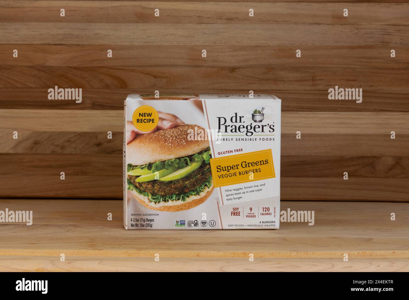 package of Dr. Praeger's brand frozen veggie burgers, gluten free with super greens, on a wood background with copy space Stock Photo