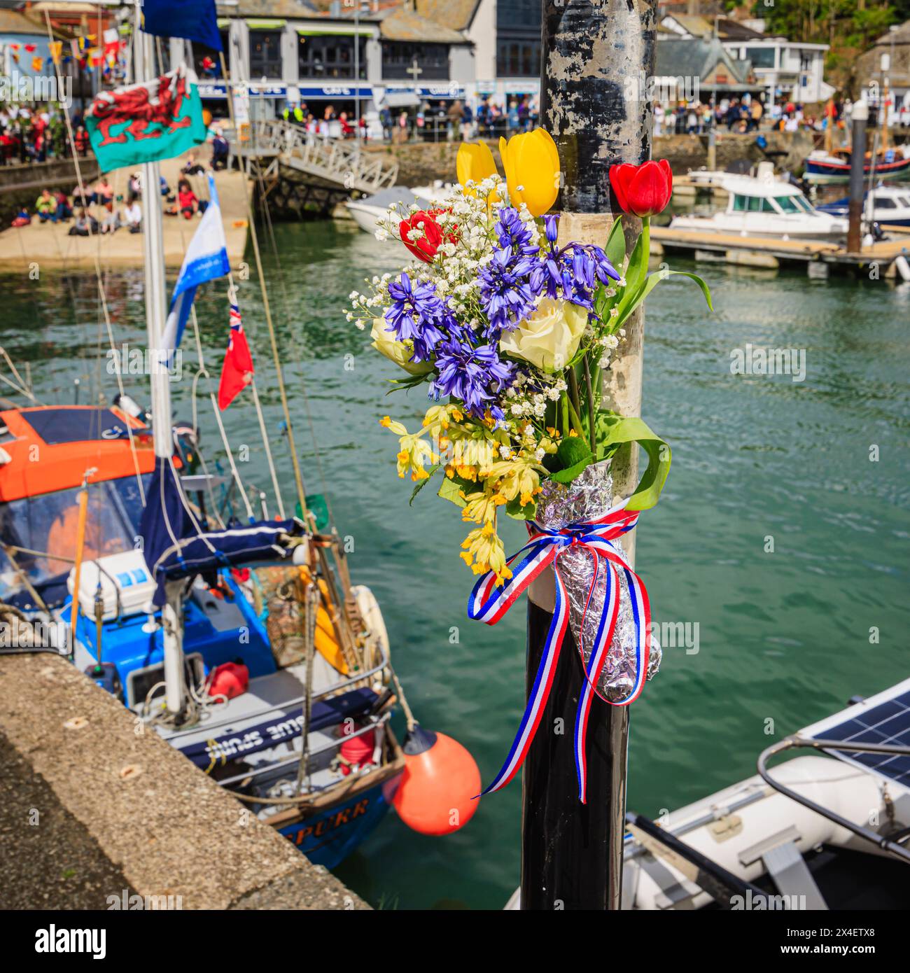 Garland of bluebells and cowslips by the harbour for the 'Obby 'Oss