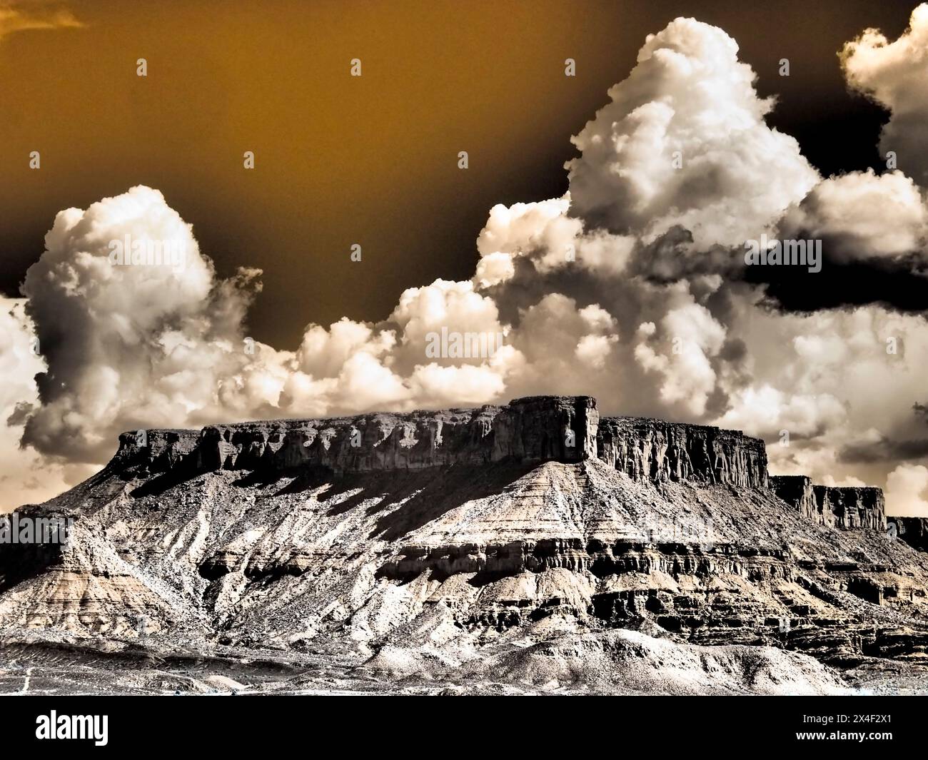 USA, Utah. Infrared of Fisher Towers with large clouds Stock Photo