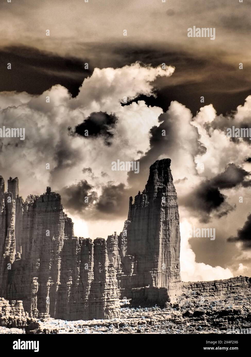 USA, Utah. Infrared of Fisher Towers with large clouds Stock Photo