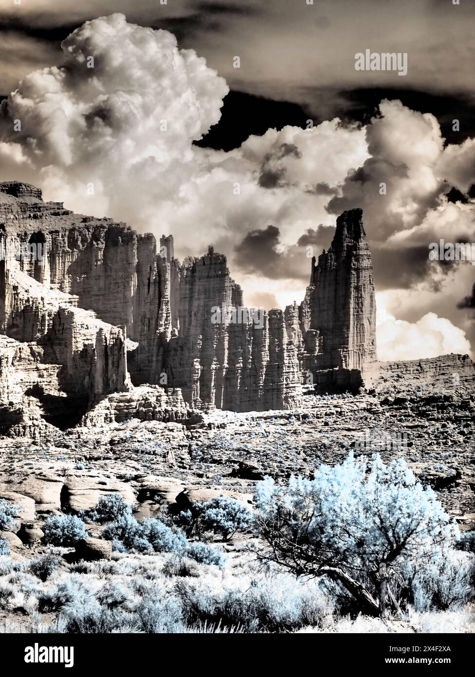USA, Utah. Infrared of Fisher Towers with large clouds Stock Photo