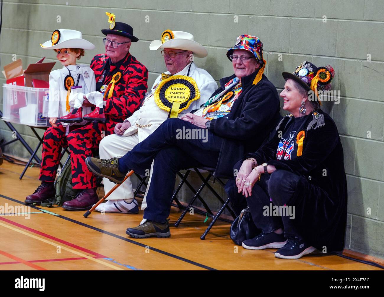 Members of the Monster Raving Loony party wait ahead of the declaration during the count for the Blackpool South by-election at Blackpool Sports Centre, Blackpool. The by-election was triggered after the resignation of Scott Benton. Picture date: Friday May 3, 2024. Stock Photo