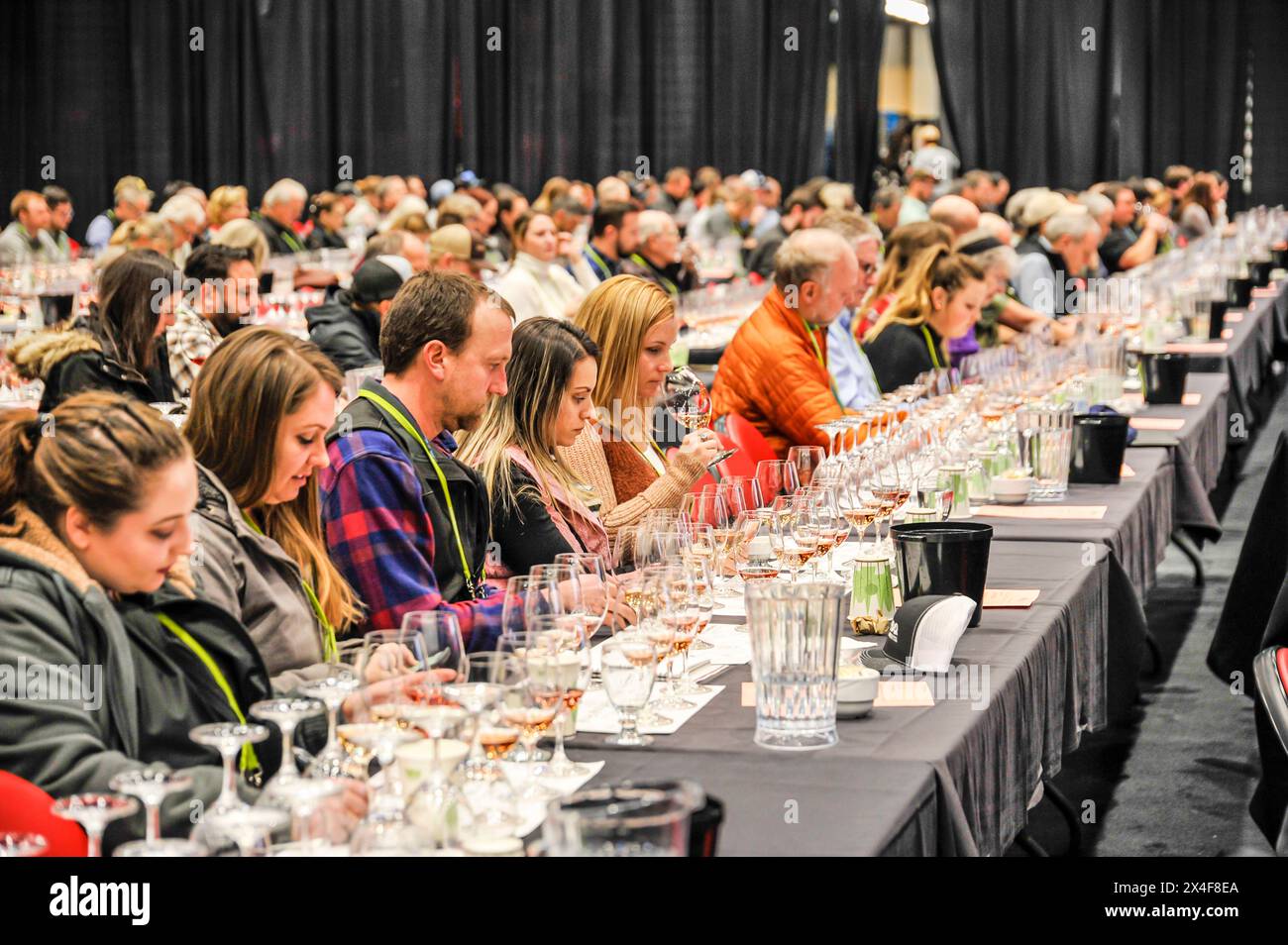 USA, Washington State, Kennewick. Wine sampling finds a perfect venue at the Washington Winegrowers conference. (Editorial Use Only) Stock Photo