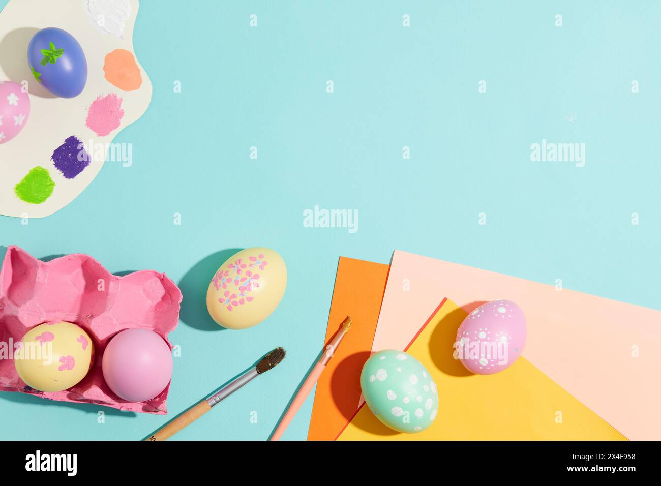 Easter eggs hand painted decorated on a light blue background with ...