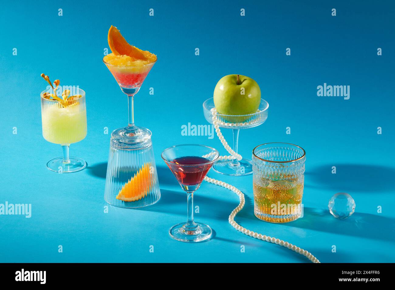 Many delicious drinks glasses are decorated on a blue background ...