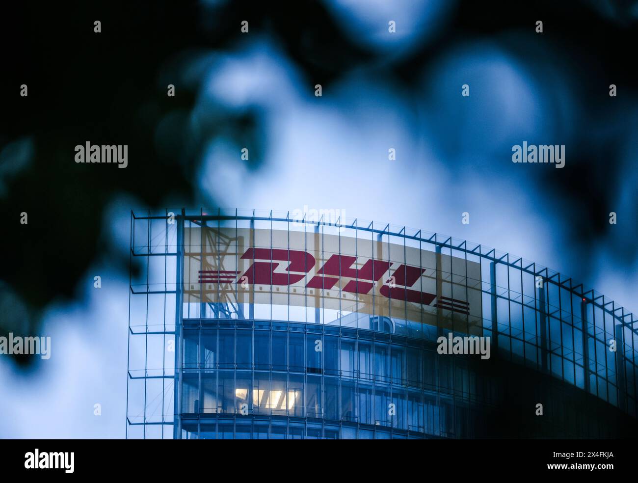 Bonn, Germany. 03rd May, 2024. The DHL logo hangs on the Post Tower. Deutsche Post AG holds its Annual General Meeting. The company has changed its name to DHL, except on the stock exchange, where it is still called Deutsche Post AG. Credit: Oliver Berg/dpa/Alamy Live News Stock Photo