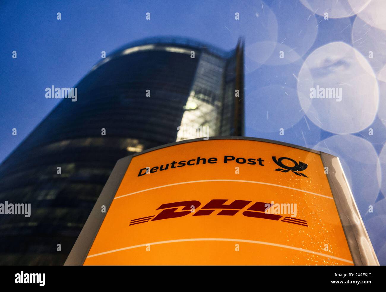 Bonn, Germany. 03rd May, 2024. The logos of Deutsche Post and DHL stand in front of the Posttower. Deutsche Post AG holds its Annual General Meeting. The company has changed its name to DHL, except on the stock exchange, where it is still called Deutsche Post AG. Credit: Oliver Berg/dpa/Alamy Live News Stock Photo