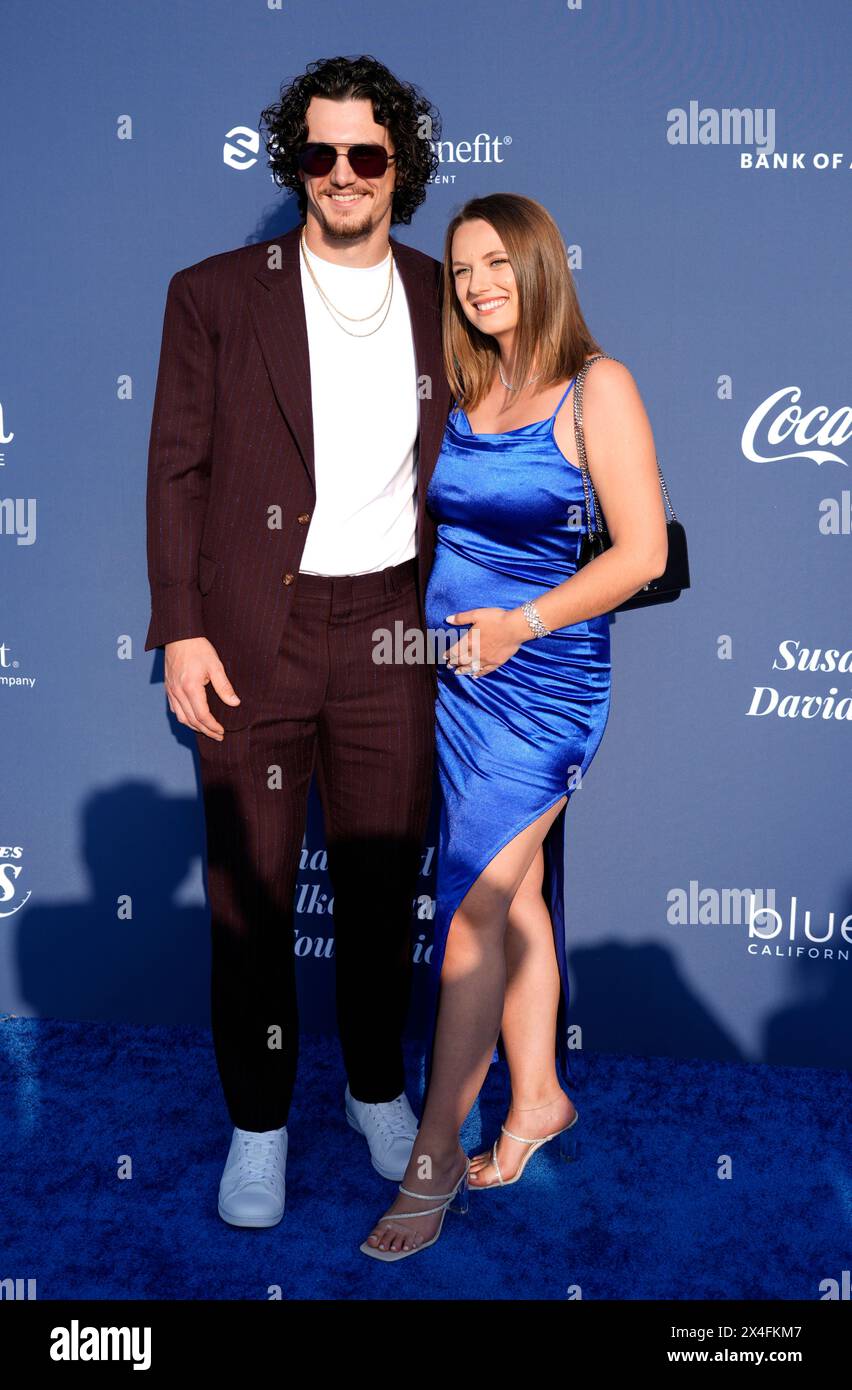 Los Angeles Dodgers' James Outman and his wife Dasha pose together at