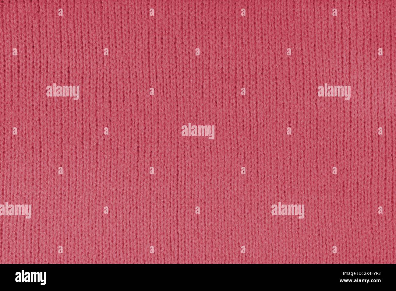 Red knitted woolen jersey fabric, sweater, pullover texture background. Fabric abstract backdrop, cloth wallpaper Stock Photo