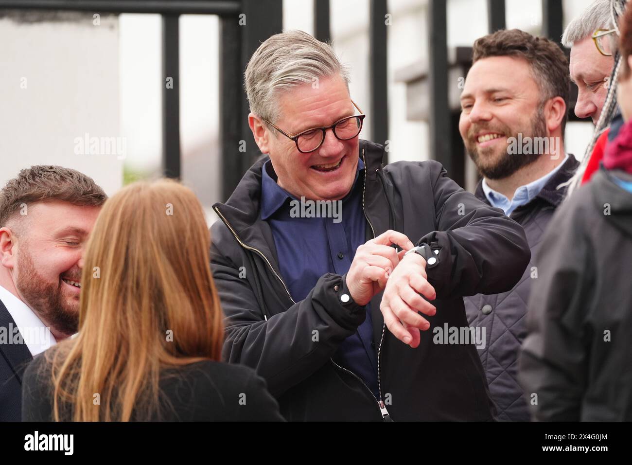 Labour leader Sir Keir Starmer looks at his watch as he celebrates at Blackpool Cricket Club after Chris Webb was declared winner in the Blackpool South by-election. The by-election was triggered after the resignation of Scott Benton. Picture date: Friday May 3, 2024. Stock Photo