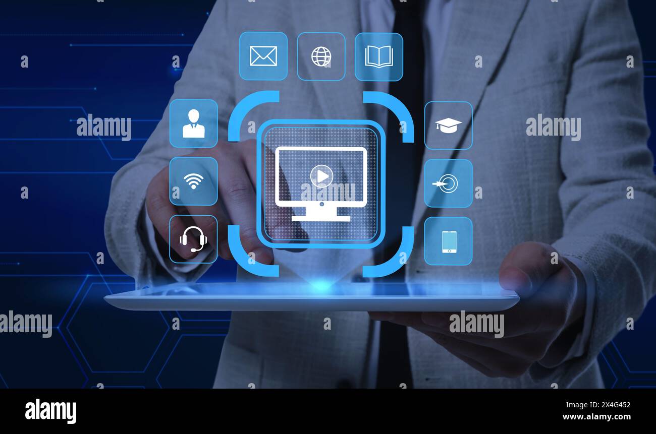 Webinar. Man using tablet on dark blue background, closeup. Virtual screen with icons over device Stock Photo