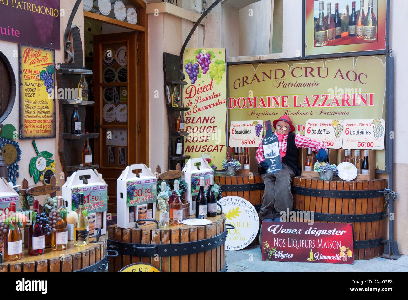 Saint-Florent, Haute-Corse, Corsica, France. Attractive display of Patrimonio wines outside town centre wine shop. Stock Photo