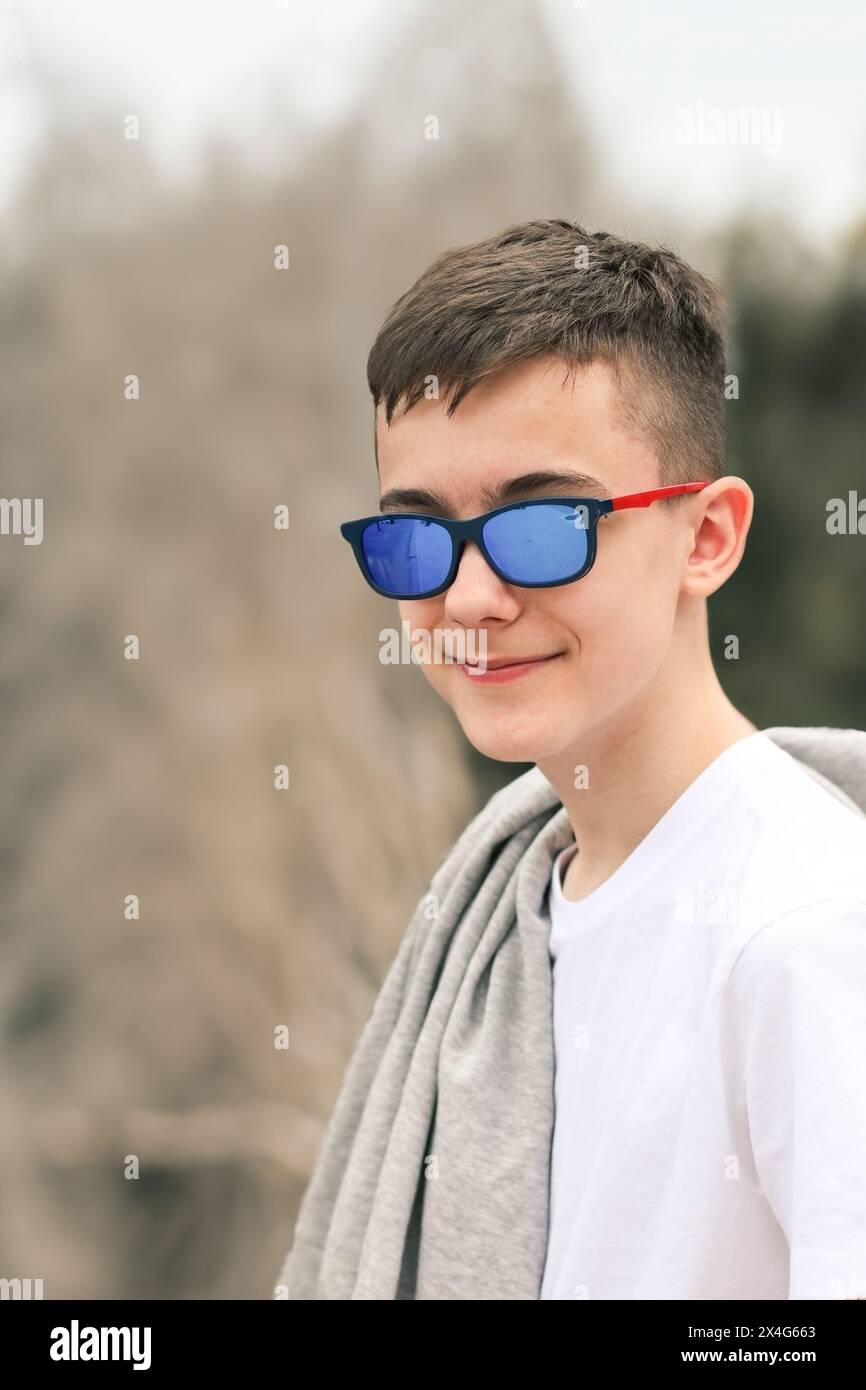 Portrait of teenager in casual clothes at blurred background Stock Photo