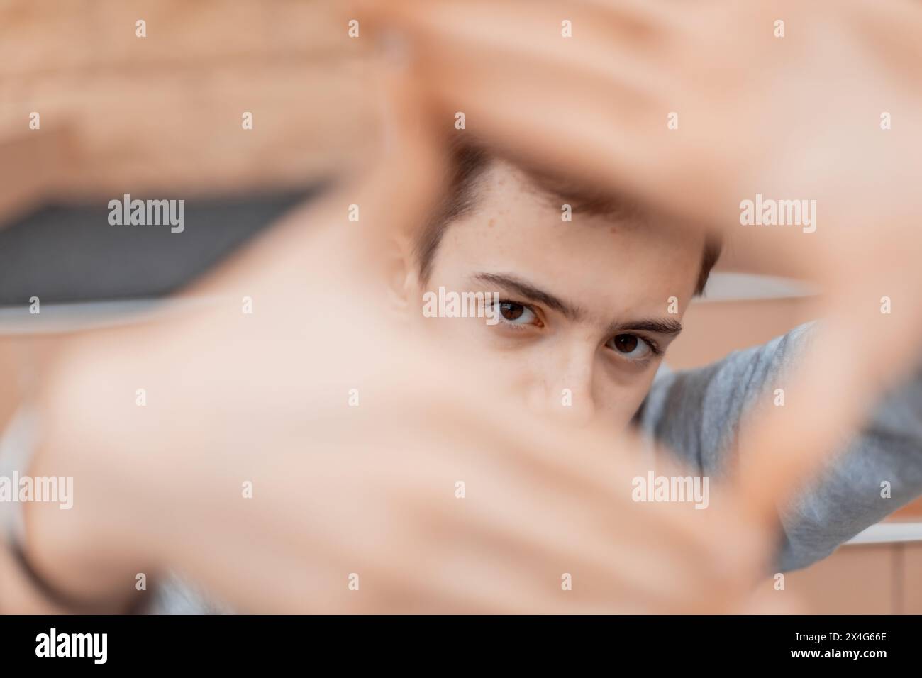 Selective focus on adolescent eyes looking in camera. Stock Photo