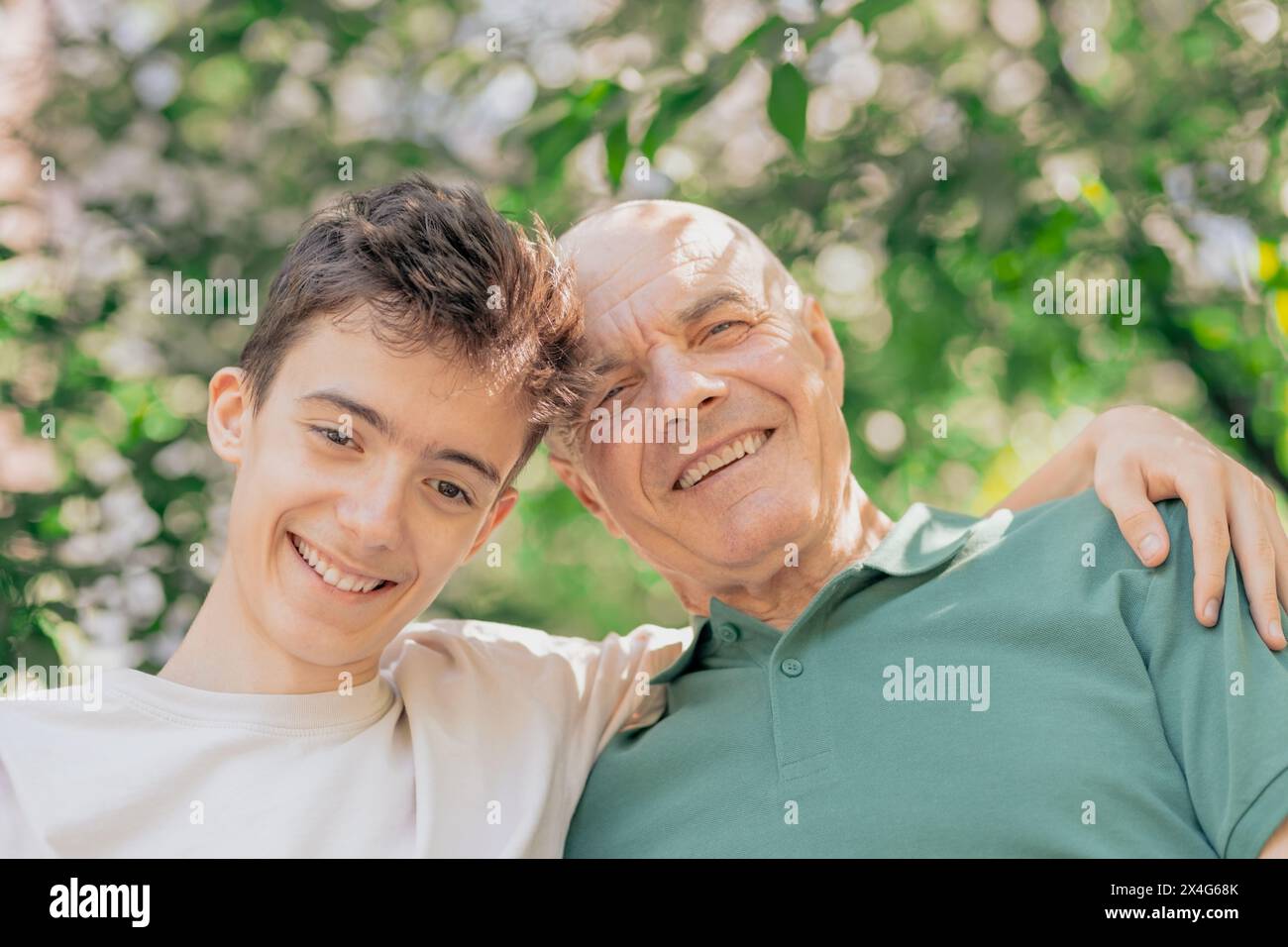 Portrait of senior man with his grandson Stock Photo