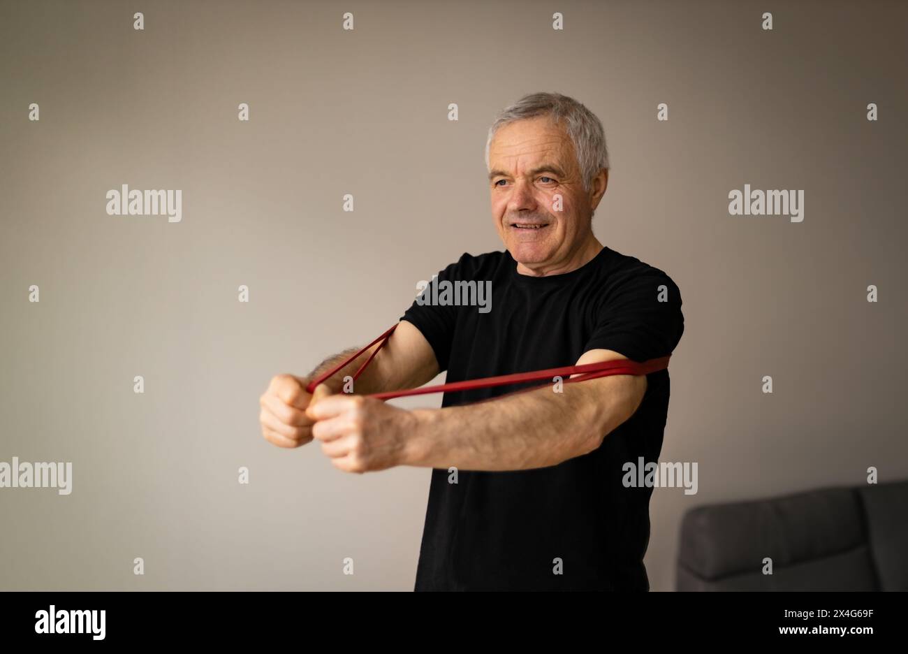 Adult man doing stretching at home Stock Photo