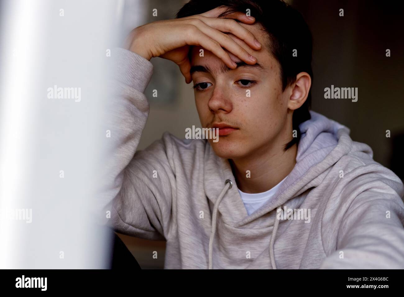 Portrait of a sad teenager in casual clothes Stock Photo