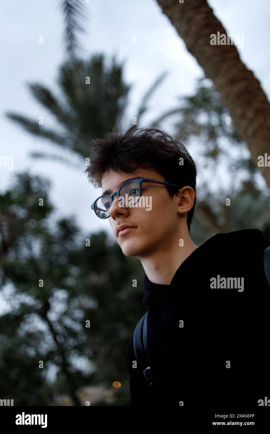 Pensive young person in glasses Stock Photo