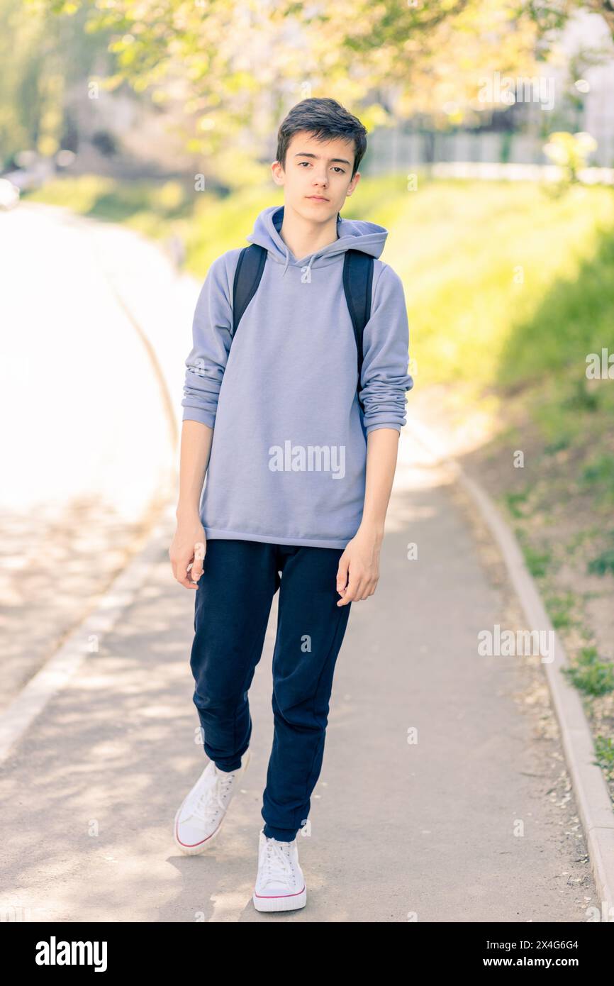 Portrait of adolescent in casual clothes on the street Stock Photo