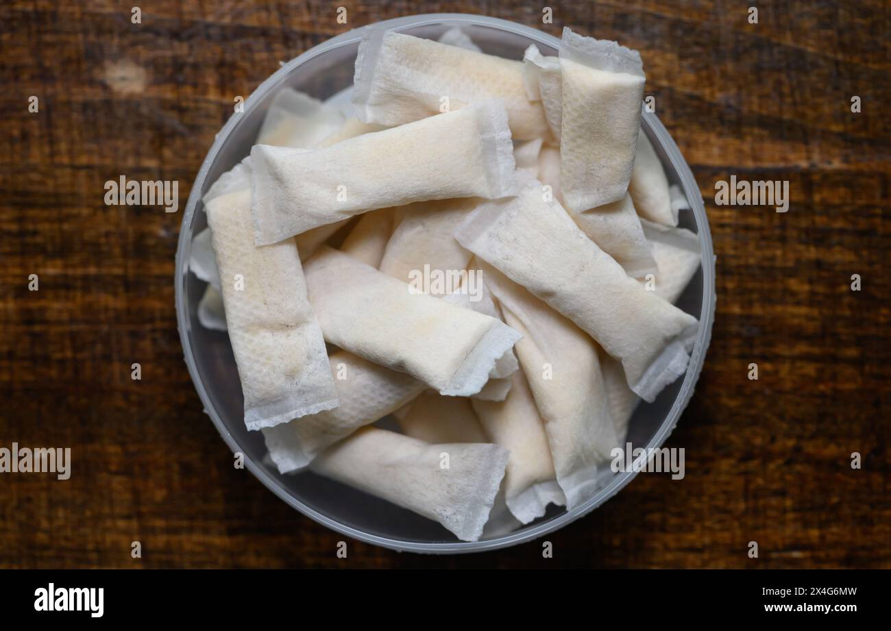 Dresden, Germany. 03rd May, 2024. Tobacco-free nicotine pouches lie in a  tin on a table. Credit: Robert Michael/dpa/Alamy Live News Stock Photo
