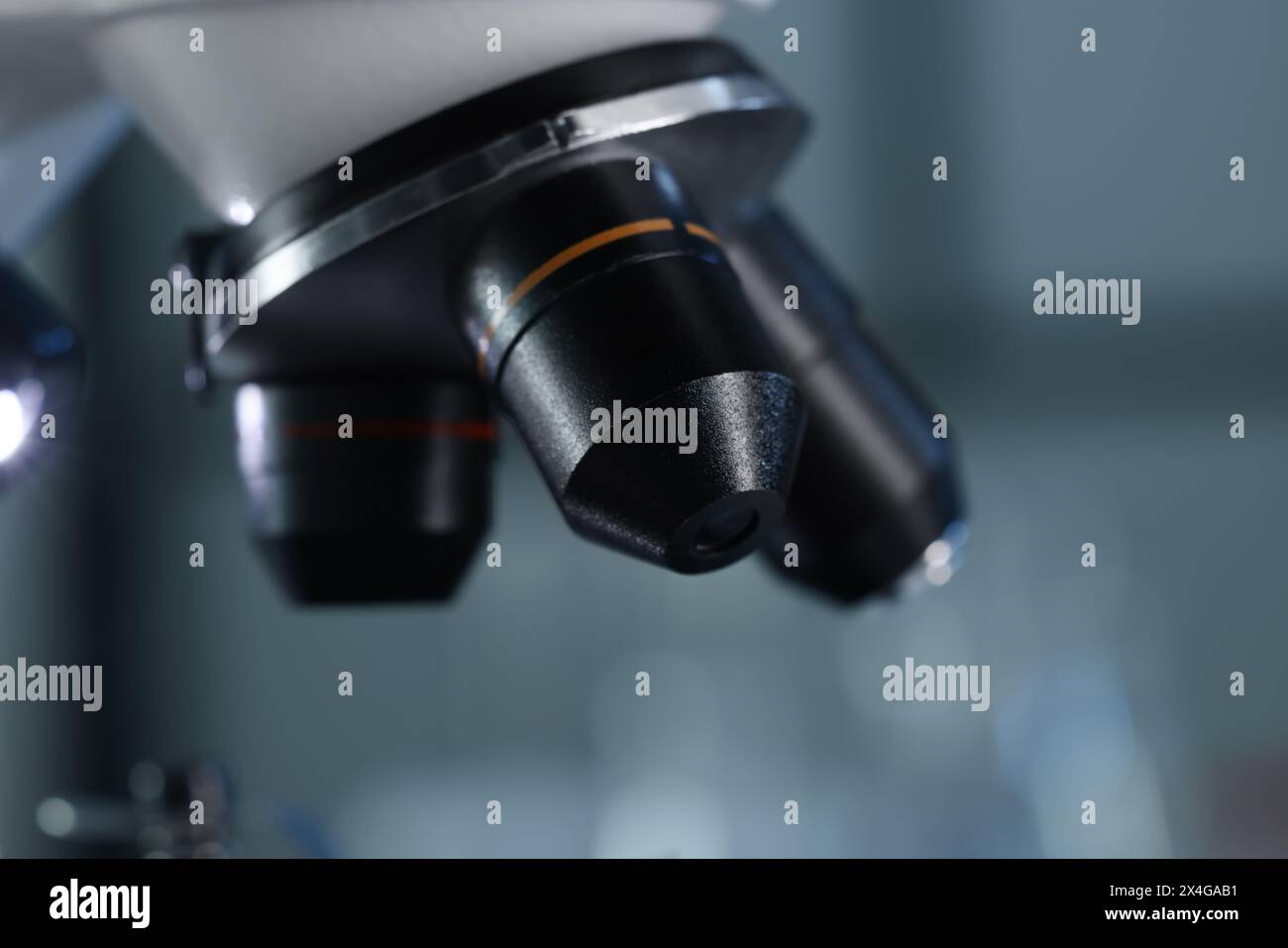 One microscope on blurred background, closeup view Stock Photo - Alamy