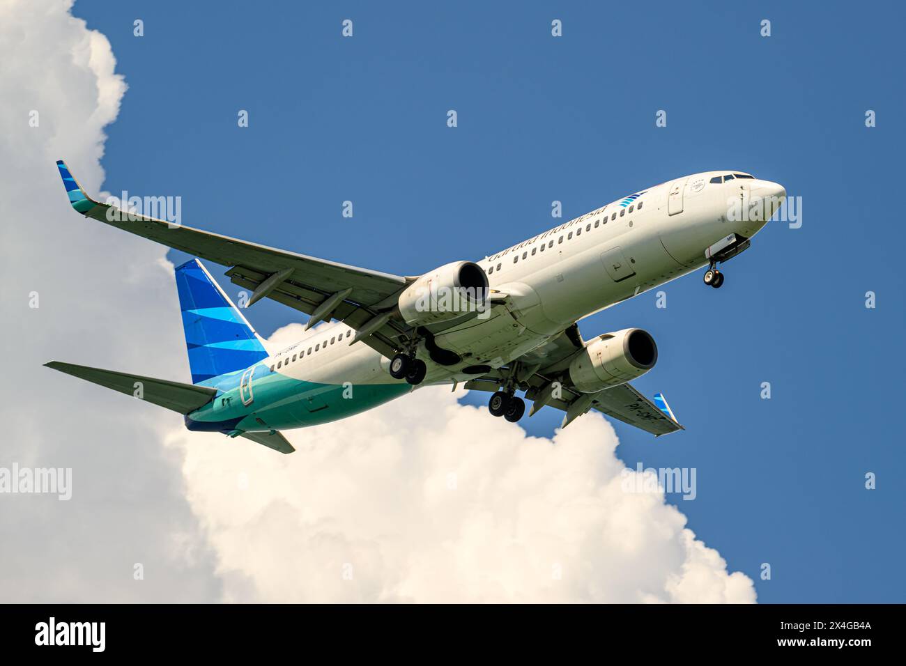 Garuda Indonesia, Boeing 737-800, PK-GMF, on final approach to Singapore Changi airport Stock Photo