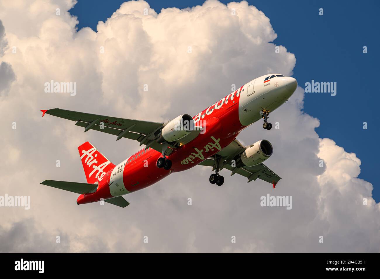 Indonesia AirAsia, Airbus A320-200, PK-AZX, on final approach to Singapore Changi airport Stock Photo