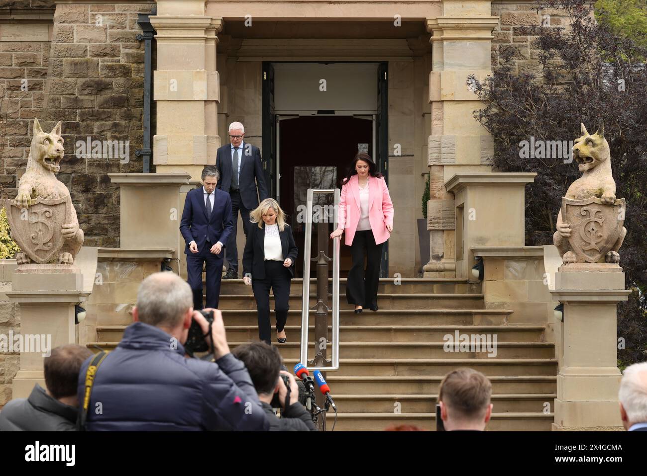 Taoiseach Simon Harris with First Minister Michelle O'Neill and deputy First Minister Emma Little-Pengelly, leaving Stormont Castle after a meeting as he makes his first official visit to Northern Ireland. Picture date: Friday May 3, 2024. Stock Photo