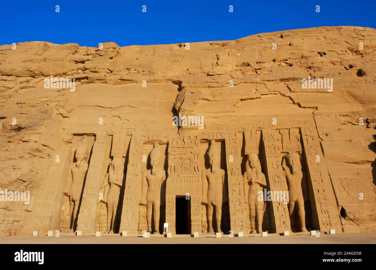 Abu Simbel, Egypt. Temple of Hathor or Temple of Nefertari, or also called Small Temple. It was built during the reign of Pharaoh Ramesses II (ca. 1279 BC-1213 BC) and dedicated to his wife, Queen Nefertari. View of the facade. Stock Photo