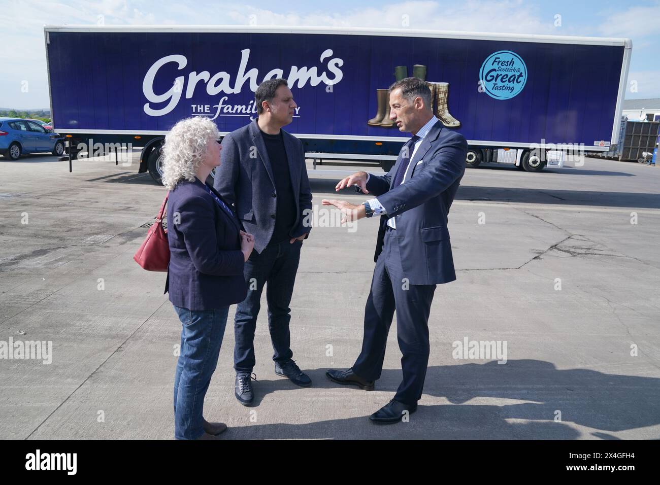 Scottish Labour leader Anas Sarwar chats with Robert Graham from Graham's The Family Dairy Dairy during a visit to the dairy in Bridge of Allan. Picture date: Friday May 3, 2024. Stock Photo