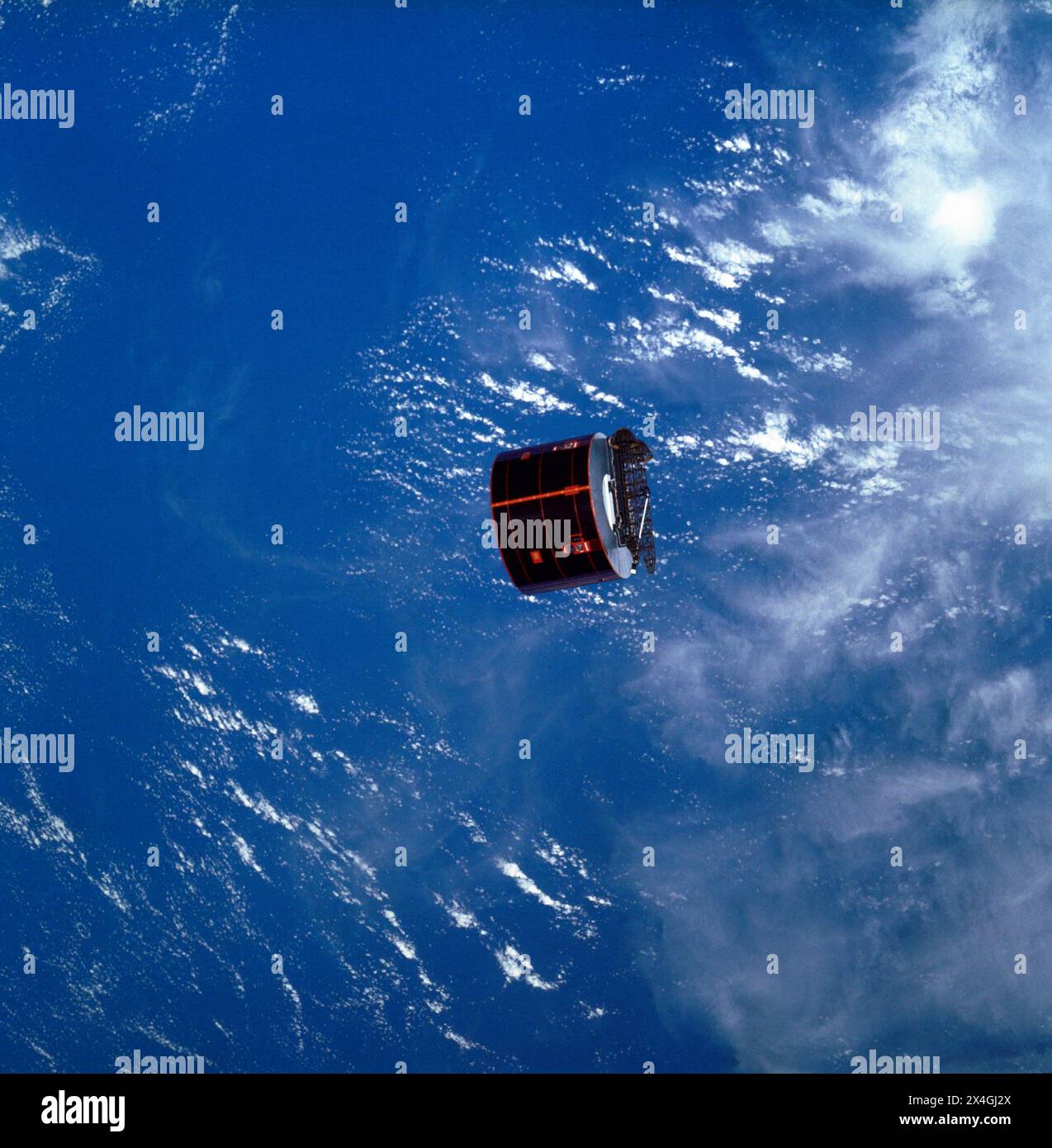 Satelittle view above Earth. SYNCOM IV-3, also known as LEASAT 3, satellite moves away from the Space Shuttle Orbiter Discovery. The satellite was launched on April 12, 1985, aboard the Space Shuttle Orbiter Discovery. Stock Photo