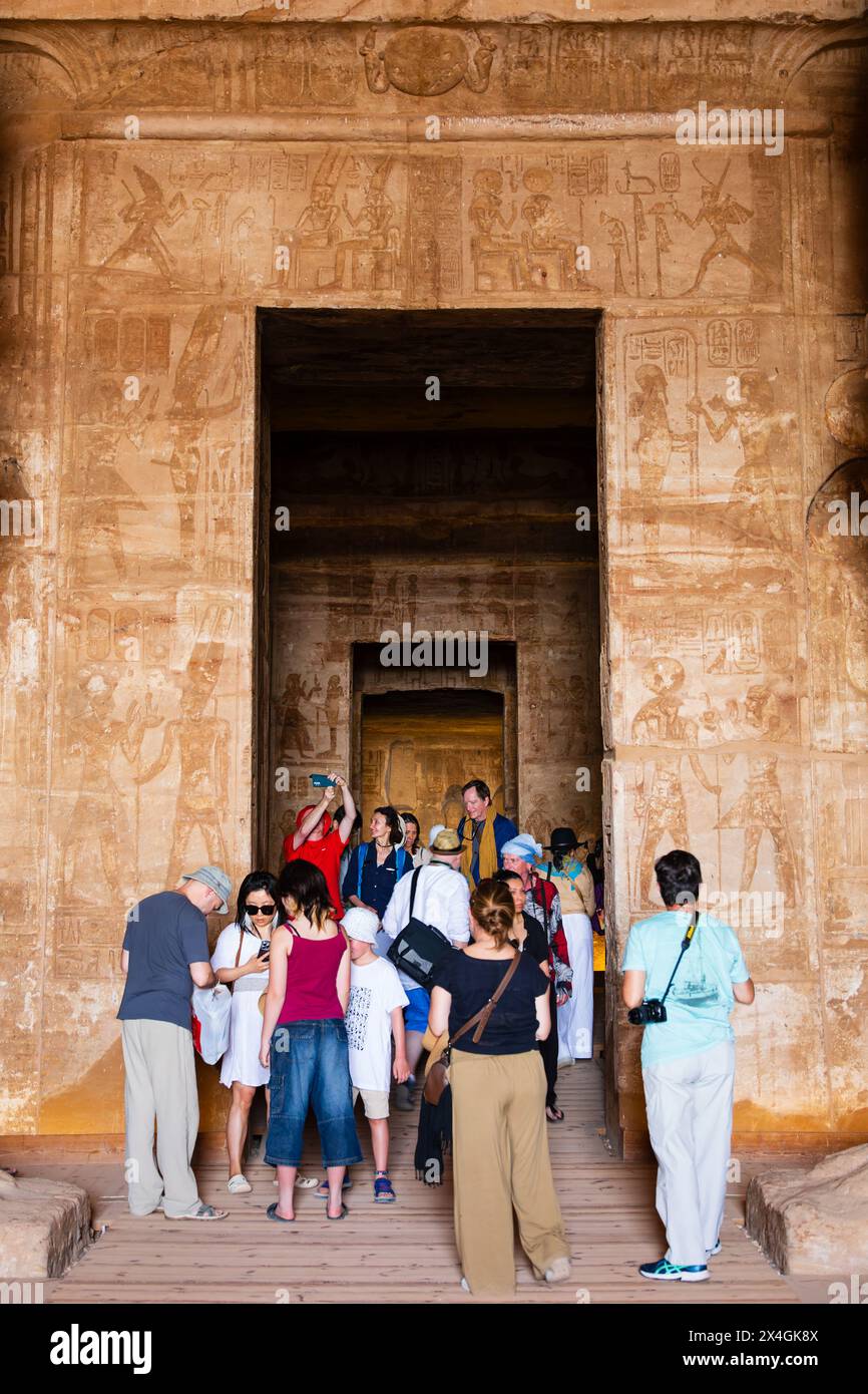 Tourists inside the tomb of Ramses II temple, Abu Simbel, Aswan, Egypt Stock Photo