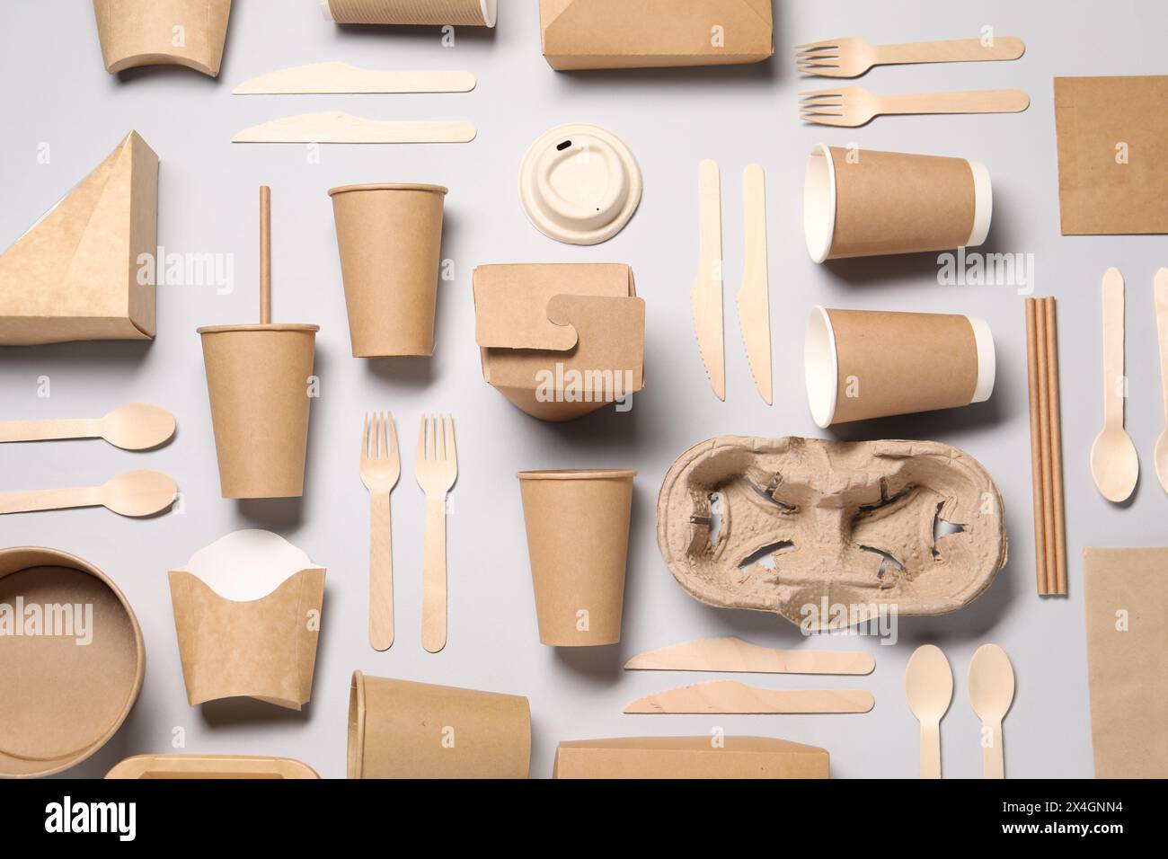 Flat lay composition with eco friendly food packagings on light grey background Stock Photo