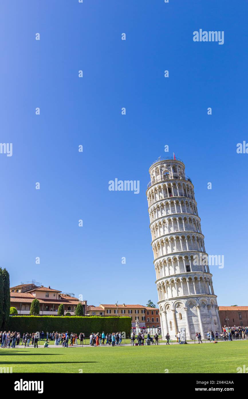 Tourists walking around the leaning tower of Pisa, Italy Stock Photo