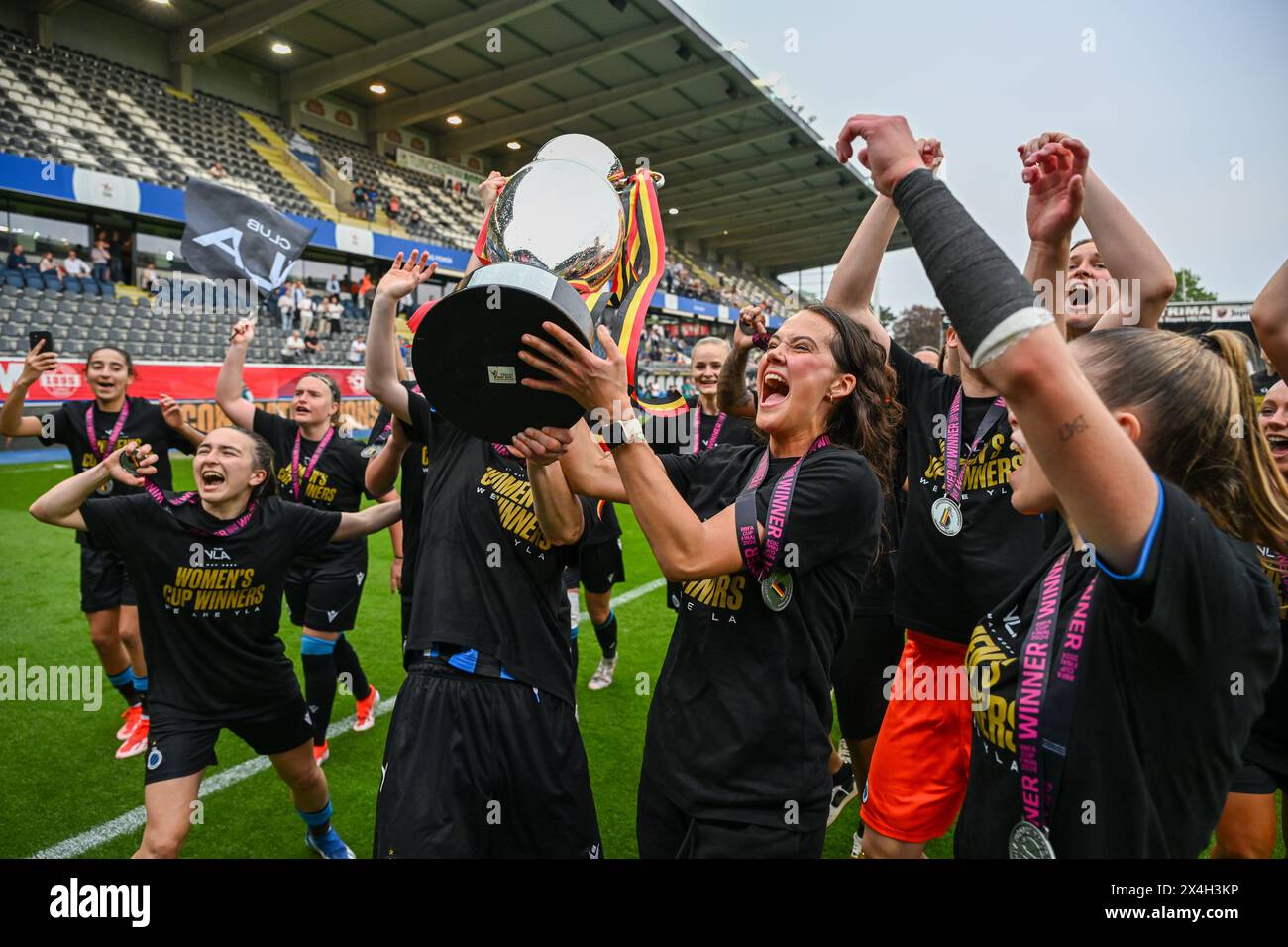 players of Club YLA celebrate after winning a female soccer game