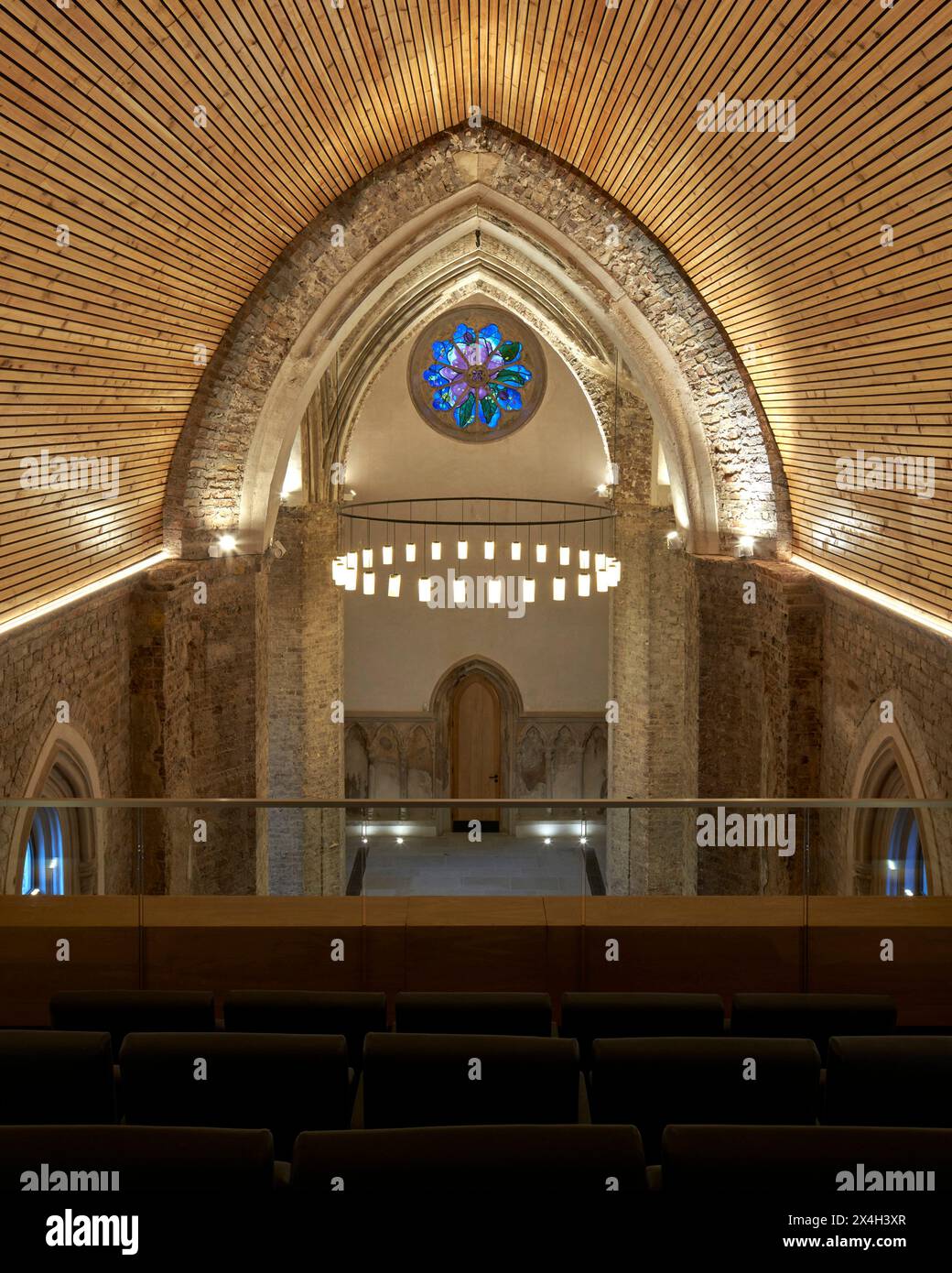 Elevated view from gallery with vaulted ceiling and stained glass ...