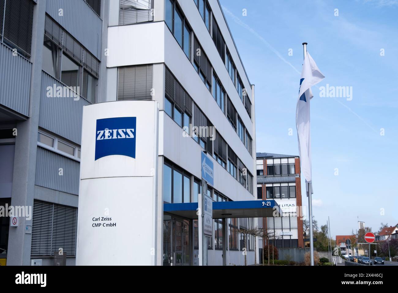modern building featuring with Advertising signboard Carl Zeiss company in Goettingen, production high-quality microscopes, telescopes, optical device Stock Photo